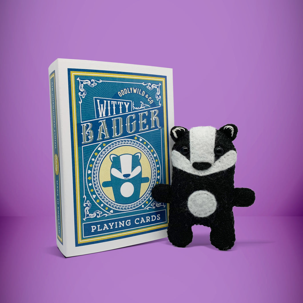 Mini black and white badger felt toy that comes in its own bespoke matchbox. Complete with pillow and bedding - perfect for tucking in at night time. Your little friend also comes with an adoption certificate, collectible playing card, and thank you card.
