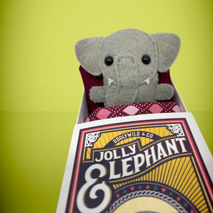 Handmade from felt this mini grey elephant toy stands 110mm high and is perfect for your kids to that with them on their travels and adventures. Your little friend is small enough to fit in a pocket and comes with its own matchbox and bedding. 