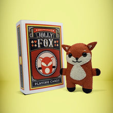 Load image into Gallery viewer, Mini red-orange fox felt toy that comes in its own bespoke matchbox. Complete with pillow and bedding - perfect for tucking in at night time. Your little friend also comes with an adoption certificate, collectible playing card, and thank you card.