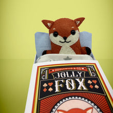 Load image into Gallery viewer, Handmade from felt this mini red-orange fox toy stands 110mm high and is perfect for your kids to that with them on their travels and adventures. Your little friend is small enough to fit in a pocket and comes with its own matchbox and bedding. 