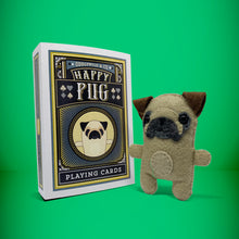 Load image into Gallery viewer, Mini pug dog felt toy that comes in its own bespoke matchbox. Complete with pillow and bedding - perfect for tucking in at night time. Your little friend also comes with an adoption certificate, collectible playing card, and thank you card.