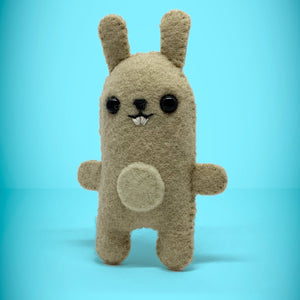 Front view of bunny rabbit toy. A perfect little gift for any rabbit lover. Super cute, handmade from left over felt and a great keepsake present. Your little friend loves to cuddle, give hugs and comes with their own matchbox to sleep in. A wonderful stocking filler at christmas.