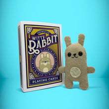 Load image into Gallery viewer, Mini bunny rabbit felt toy that comes in its own bespoke matchbox. Complete with pillow and bedding - perfect for tucking in at night time. Your little friend also comes with an adoption certificate, collectible playing card, and thank you card.
