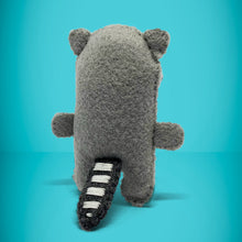 Load image into Gallery viewer, Back view of mini raccoon toy. Handmade small felt worry monster/ animal/ raccoon / trash panda. A perfect gift to give anyone with anxiety, they can simply write down their worries and put them away with their little friend at night time.