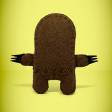 Load image into Gallery viewer, The back view of our handmade felt mini sloth toy stands 110mm high and is perfect for your kids to that with them on their adventures. Your little friend is small enough to fit in a pocket and comes with its own matchbox and bedding.