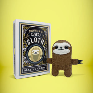 Mini brown sloth felt toy that comes in its own bespoke matchbox. Complete with pillow and bedding - perfect for tucking in at night time. Your little friend also comes with an adoption certificate, collectible playing card, and thank you card.
