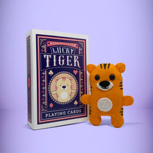 Load image into Gallery viewer, Mini orange tiger felt toy that comes in its own bespoke matchbox. Complete with pillow and bedding - perfect for tucking in at night time. Your little friend also comes with an adoption certificate, collectible playing card, and thank you card.