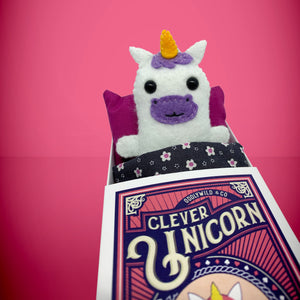 Handmade from felt this mini white unicorn toy stands 110mm high and is perfect for your kids to that with them on their travels and adventures. Your little friend is small enough to fit in a pocket and comes with its own matchbox and bedding. 