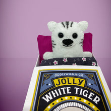 Load image into Gallery viewer, Handmade from felt this mini white tiger toy stands 110mm high and is perfect for your kids to that with them on their travels and adventures. Your little friend is small enough to fit in a pocket and comes with its own matchbox and bedding. 